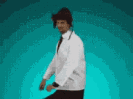 a man in a white shirt and tie is dancing in front of a blue background .