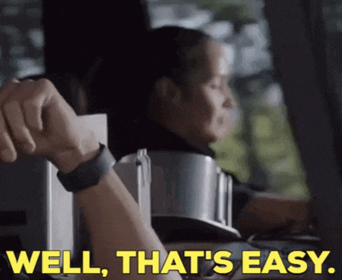 a woman sitting in a car with the words well that 's easy