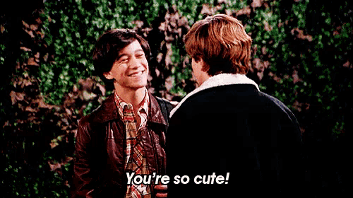 two men are standing next to each other and one of them is saying you 're so cute