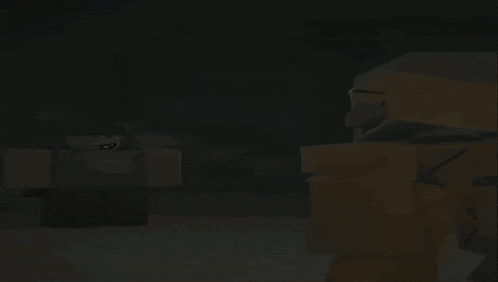 a man and a yellow robot are standing next to each other in a dark room