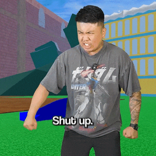 a man wearing a shirt that says " shut up "