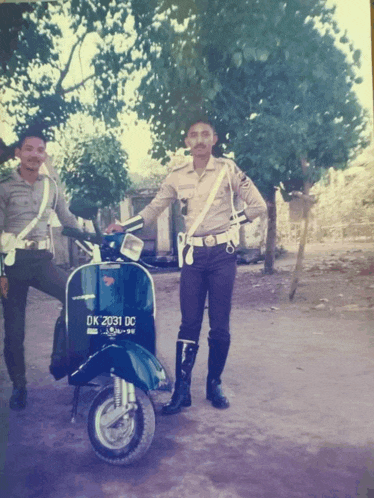 a man standing next to a scooter with a license plate that says ok 2031 dc