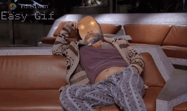 a gif of a man laying on a couch with the words " easy gif " above him