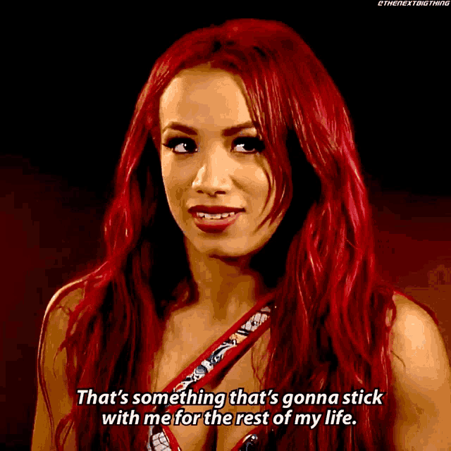 a woman with red hair is talking about something that 's gonna stick with her for the rest of her life