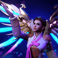 a woman in a costume with wings is standing in the dark