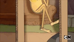 a cartoon character is sitting on a couch with his legs crossed and his feet visible .