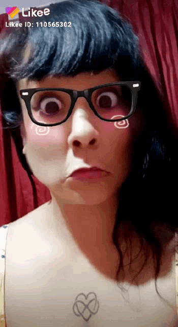 a woman wearing glasses has a likee id of 110565362