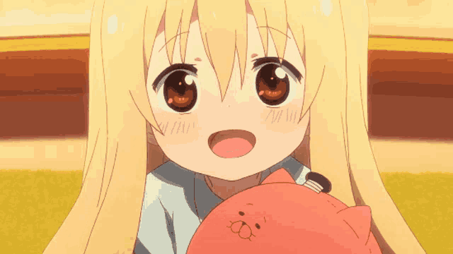 a little girl with long blonde hair is holding a stuffed animal
