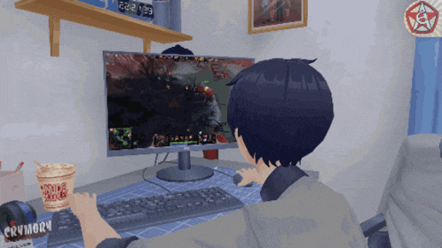 a cup of crunchy noodles sits next to a person playing a video game
