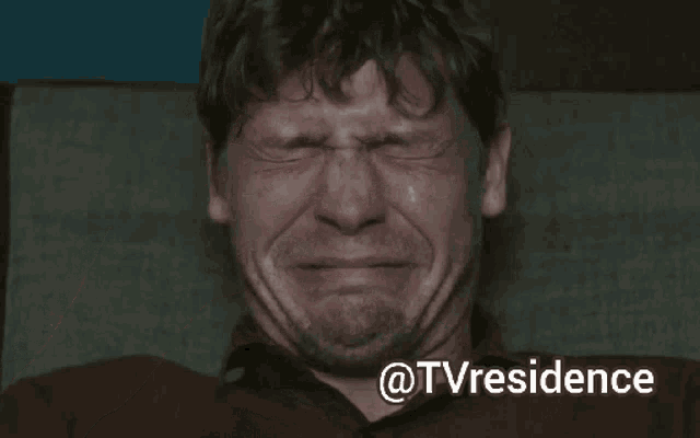 a man is crying while sitting in a chair with the words @tvresidence above him