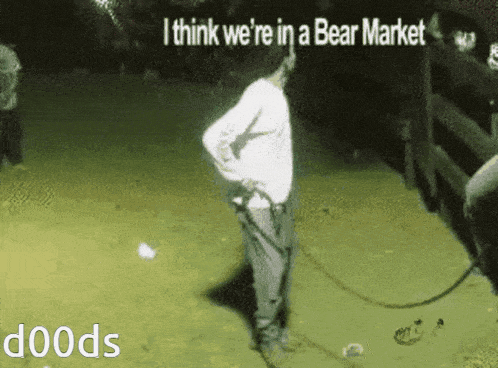 a man is standing in a field with the words i think we 're in a bear market written on the bottom