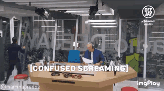 a man sitting at a table with the words confused screaming