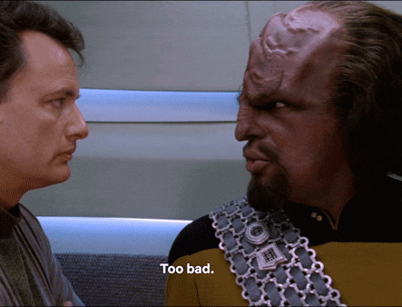 two men are looking at each other and one of them is saying too bad