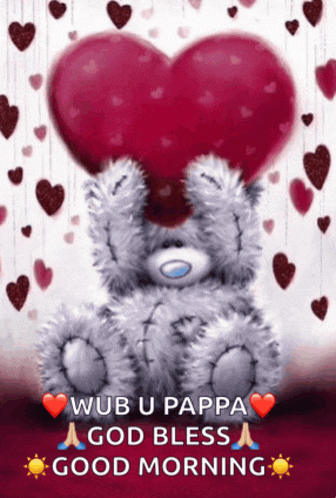 a teddy bear is holding a heart over its eyes and says good morning