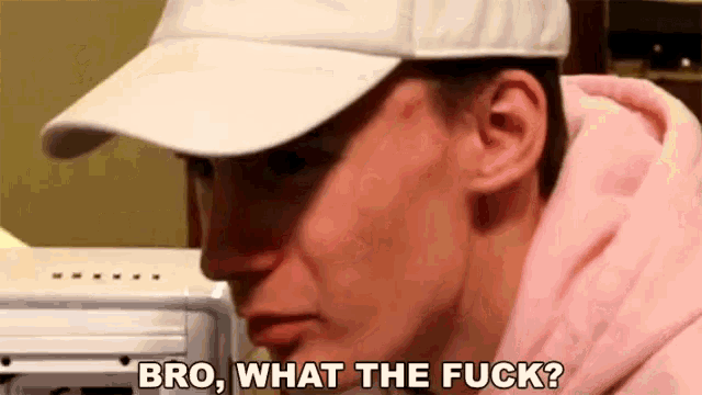 a man wearing a white hat and a pink hoodie is saying `` bro , what the fuck '' .