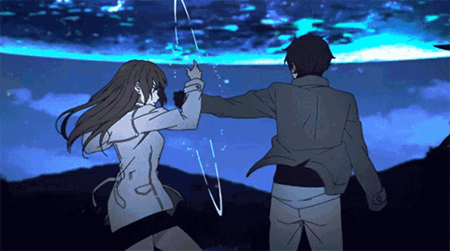 a man and a woman are standing next to each other