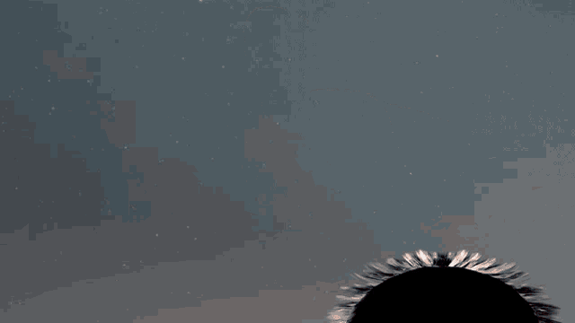 a silhouette of a man in a suit and tie reaching out