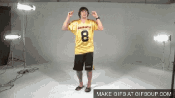 a man wearing a yellow jersey with the number eight on it