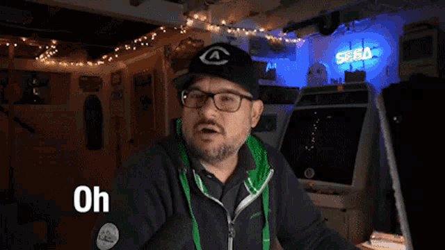 a man wearing glasses and a hat is asking " oh is it a cool game "