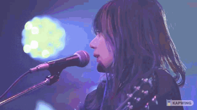 a close up of a woman 's face with the words kapwing on the bottom right