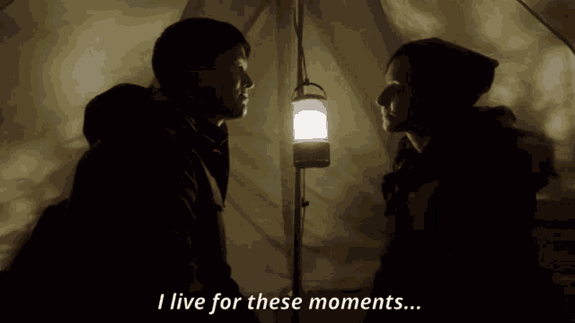 a man and a woman looking at each other with the words i live for these moments