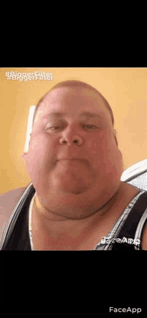 a close up of a man 's face with a very large chin and a very thick neck .
