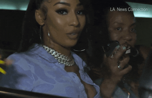 a woman with long yellow nails sticking her tongue out and the words la news connection behind her