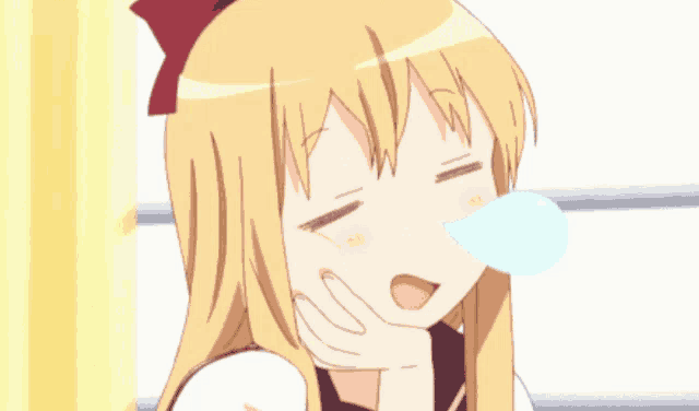 a girl with blonde hair has a red bow on her head
