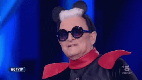a man wearing mickey mouse ears and sunglasses is on a television show