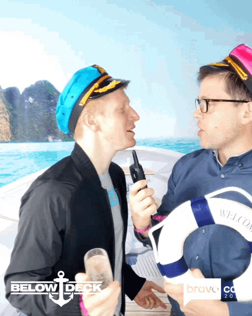 two men are standing next to each other with the words below deck behind them