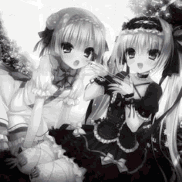 two anime girls are sitting next to each other in a black and white photo . one of the girls is holding a camera .