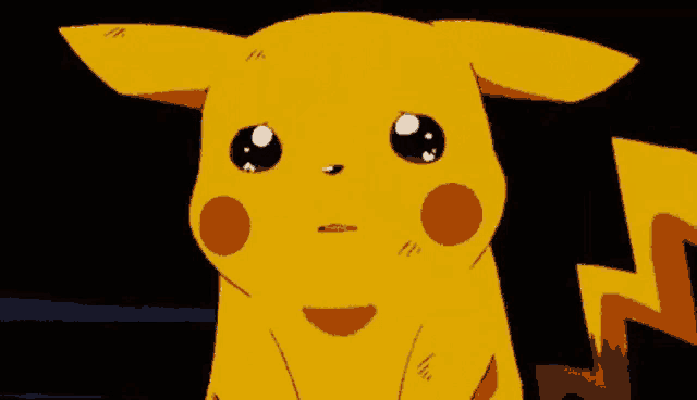 a close up of a cartoon character , pikachu , crying with tears coming out of his eyes .