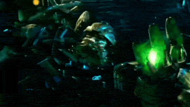 a green light is shining on a person 's hands