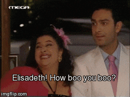 a man and a woman are standing next to each other and the woman is saying " elisabeth "