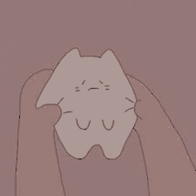 a person is holding a cartoon cat with a sad face on it .