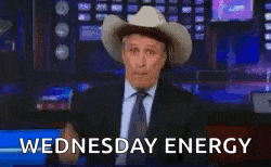a man in a suit and tie is wearing a cowboy hat on a television show .