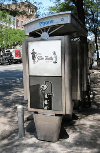a phone booth with a sign that says kim jacobs tattoo