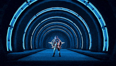 a video game character is standing in a tunnel