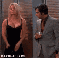 a woman in a black dress is standing next to a man in a suit and tie ..