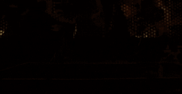 a close up of a microwave oven with a reflection of a person in it