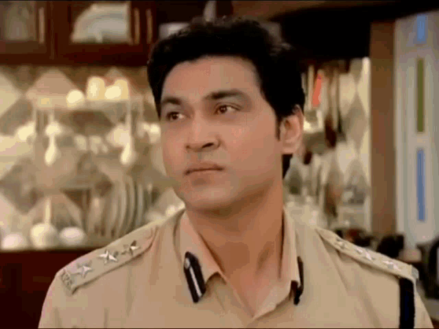 a man in a police uniform has a badge on his shoulder that says ' chief '