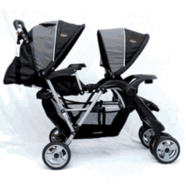 a black and grey double stroller on a white surface
