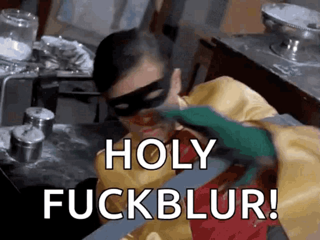 a man in a robin costume is saying holy fuck blur .