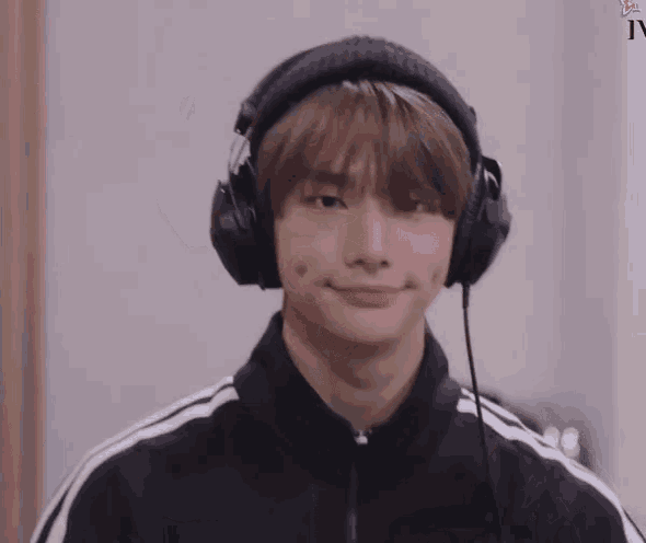 a young man wearing headphones with the letters iv on the bottom