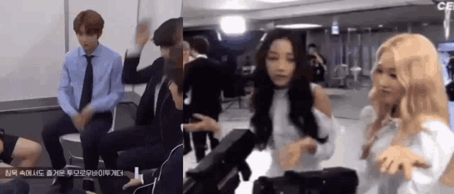 a group of people are standing next to each other in a room and dancing .