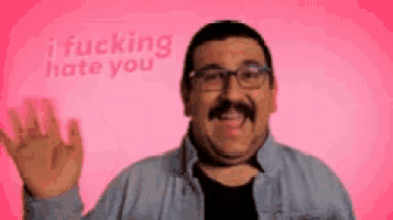 a man with glasses and a mustache is waving his hand in front of a pink background that says " i fucking hate you "