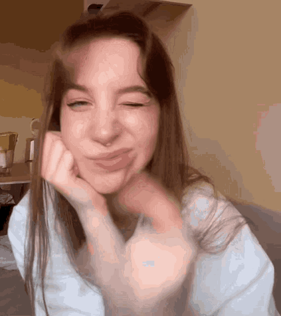 a woman with a nose ring is making a funny face