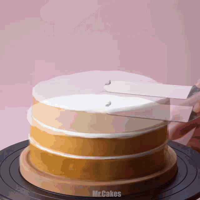 a cake is being decorated by mr.cakes