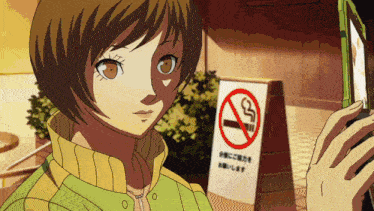 a girl is standing in front of a sign that says no smoking