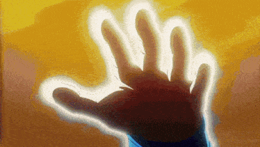 a close up of a person 's hand with a light coming out of it .